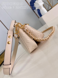 L V pochette cream 25 cm.