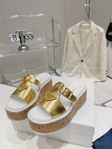 P r a d a gold wedge