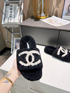 C h a n e l slippers b/w